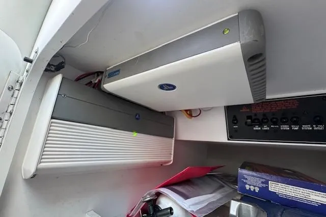 Slide: The Image of 2007 Formula 353 FASTech interior electronics and storage compartment. - 52