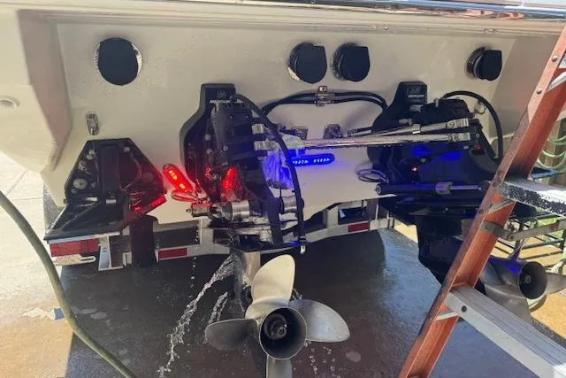 Slide: The Image of Rear view of a 2007 Formula 353 FASTech boat with illuminated engine components. - 54