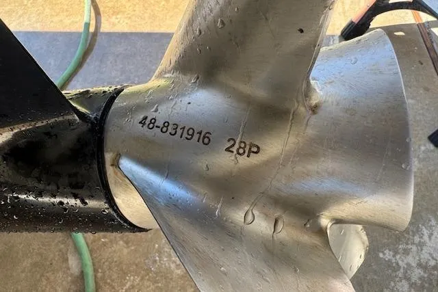 Slide: The Image of Close-up of a 2007 Formula 353 FASTech boat propeller with model number 48-831916 28P. - 58