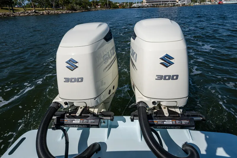 Slide: The Image of Twin Suzuki 300 outboard engines on 2019 Custom Carolina Custom Express boat. - 28