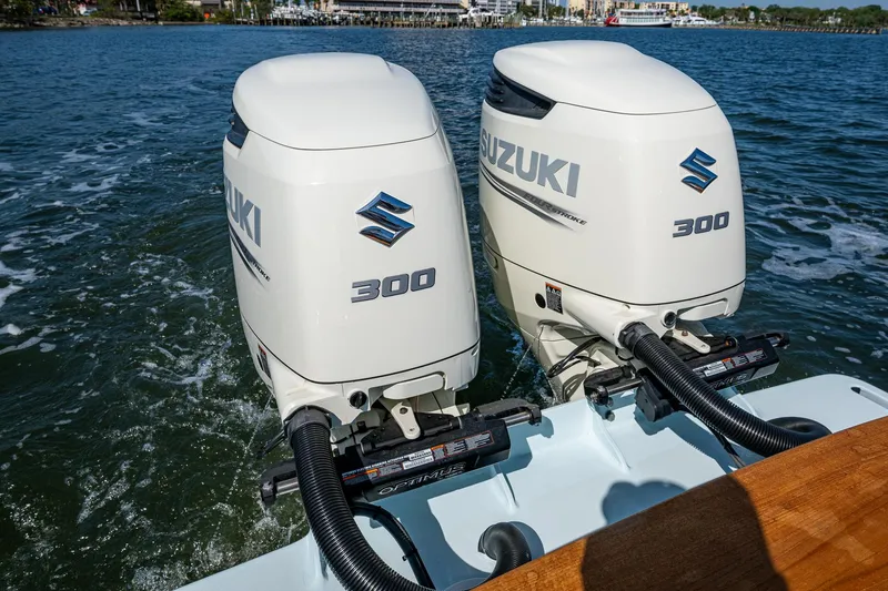Slide: The Image of Twin Suzuki 300 outboard engines on a 2019 Custom Carolina Custom Express boat. - 29