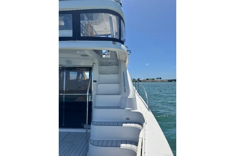 Slide: The Image of 2005 Sea Ray 550 Sedan Bridge yacht with exterior stairs and ocean view. - 15