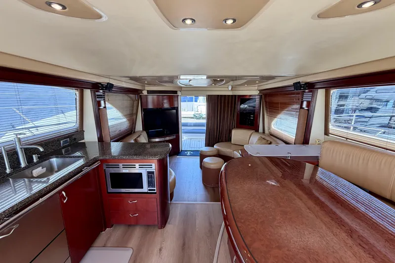 Slide: The Image of Luxurious interior of 2005 Sea Ray 550 Sedan Bridge yacht with modern amenities. - 25