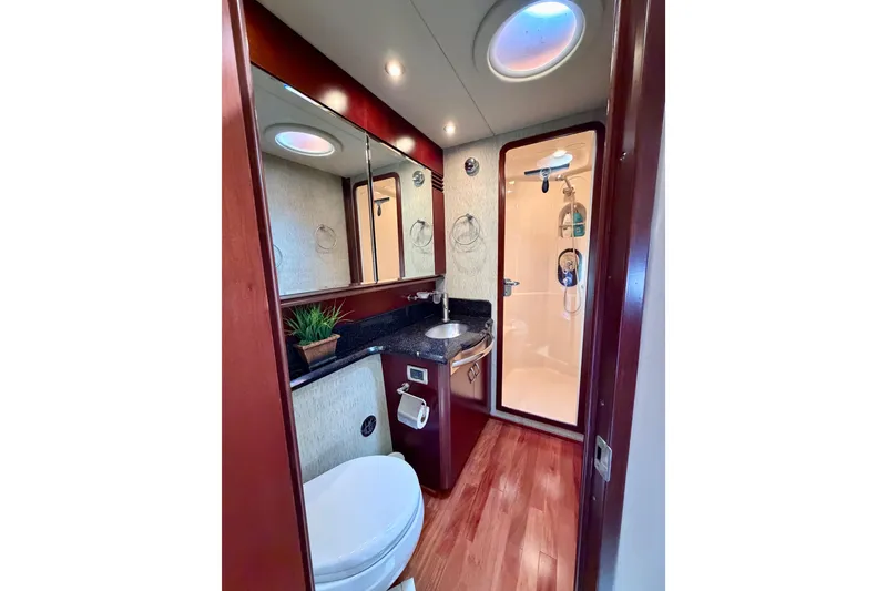 Slide: The Image of Luxurious bathroom in 2005 Sea Ray 550 Sedan Bridge yacht with shower and modern fixtures. - 29