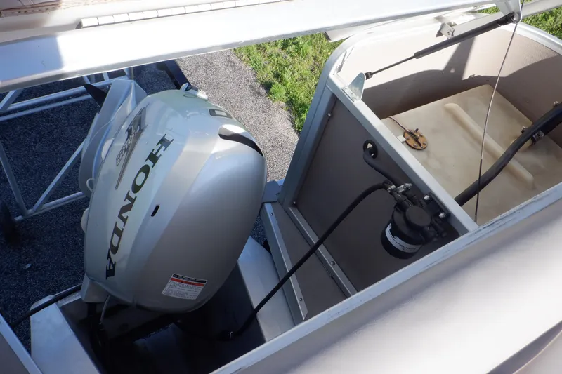 Slide: The Image of 2009 Premier 225 Sunsation LTD with Honda outboard motor, open engine compartment view. - 18