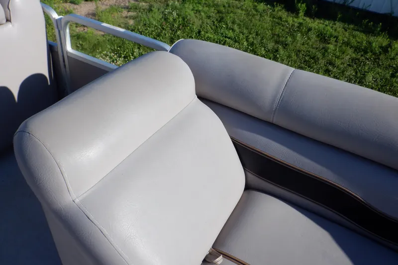 Slide: The Image of 2009 Premier 225 Sunsation LTD boat seats with light gray upholstery. - 23