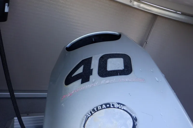 Slide: The Image of Outboard motor with "40" marking on a 2009 Premier 225 Sunsation LTD boat. - 3