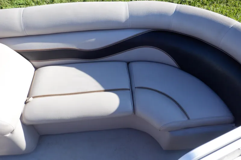 Slide: The Image of 2009 Premier 225 Sunsation LTD boat seating with white and black upholstery. - 33