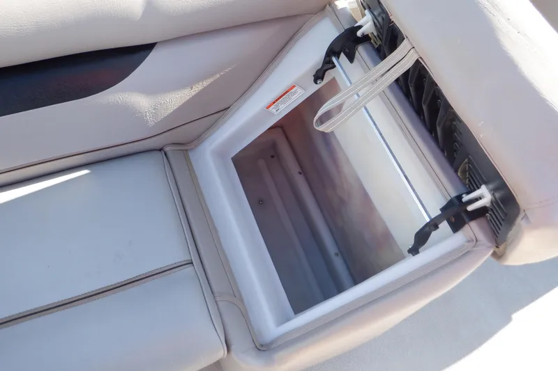 Slide: The Image of 2009 Premier 225 Sunsation LTD boat seat storage compartment, open and empty. - 34