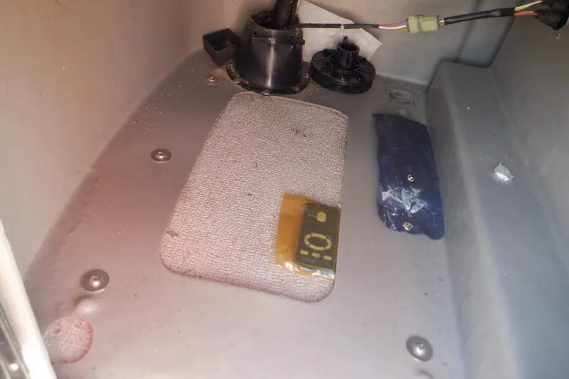 Slide: The Image of Interior compartment of 2009 Premier 225 Sunsation LTD boat with wiring and components. - 36