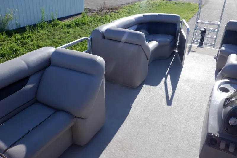 Slide: The Image of 2009 Premier 225 Sunsation LTD pontoon boat interior with gray seating and open deck. - 47