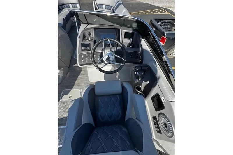 Slide: The Image of 2023 Bennington 27 RSBWA T2 boat interior with steering wheel and seating. - 11