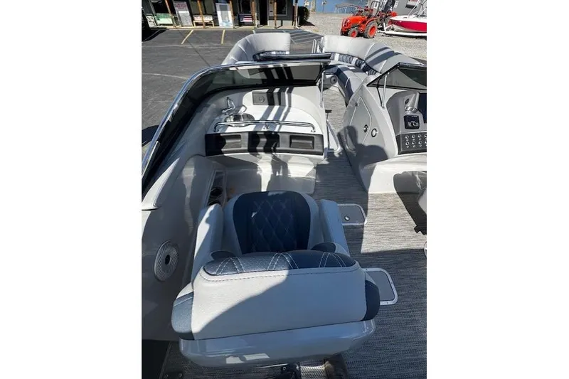 Slide: The Image of 2023 Bennington 27 RSBWA T2 boat interior with luxurious seating and modern dashboard. - 12
