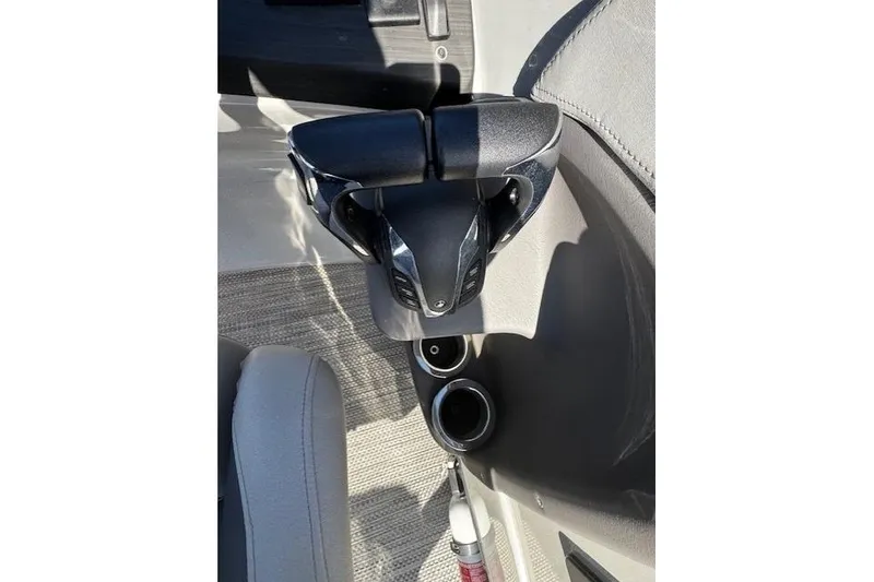 Slide: The Image of Cup holders and armrest in 2023 Bennington 27 RSBWA T2 boat interior. - 14