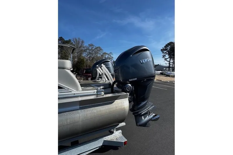 Slide: The Image of 2023 Bennington 27 RSBWA T2 pontoon boat with Yamaha outboard motor. - 19