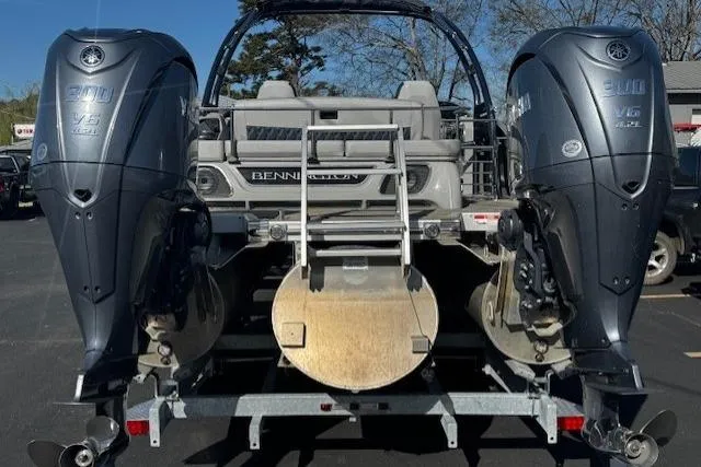 Slide: The Image of 2023 Bennington 27 RSBWA T2 boat with dual Yamaha outboard engines, rear view. - 2
