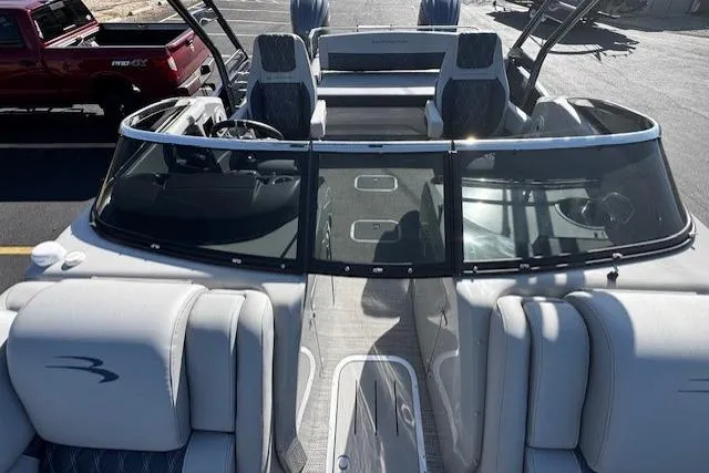 Slide: The Image of 2023 Bennington 27 RSBWA T2 pontoon boat with luxurious seating and sleek design. - 7