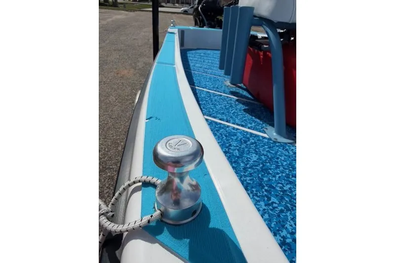 Slide: The Image of 2019 American Marine H:Skiff H13 boat deck with cleat and blue flooring. - 13