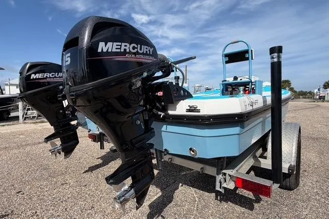 Slide: The Image of 2019 American Marine H:Skiff H13 boat with dual Mercury outboard motors on a trailer. - 4