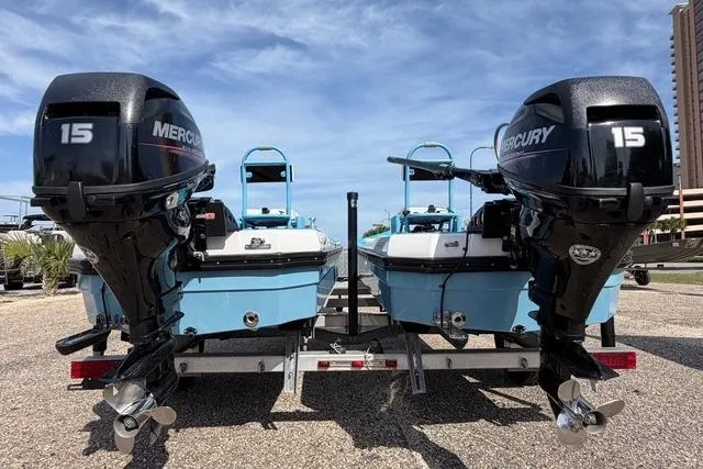 Slide: The Image of Two 2019 American Marine H:Skiff H13 boats with Mercury 15 engines on a trailer. - 5
