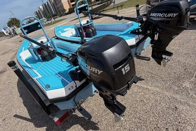 Slide: The Image of 2019 American Marine H:Skiff H13 boats with Mercury 15 engines, parked on a sunny day. - 7