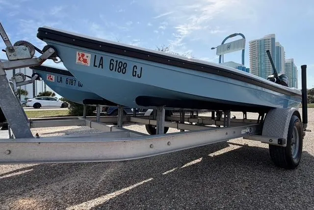 Slide: The Image of 2019 American Marine H:Skiff H13 boat on trailer, parked outdoors. - 8