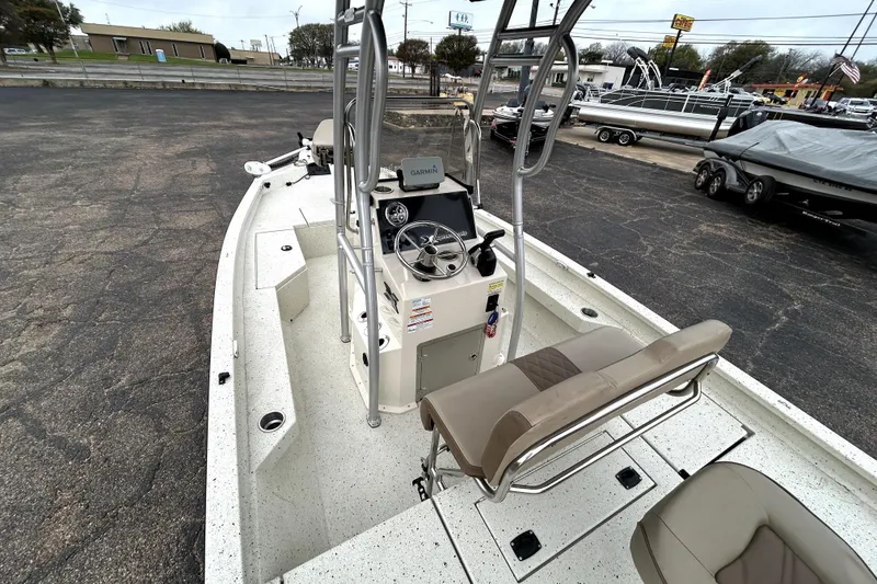 Slide: The Image of 2022 Xpress H20B Bay boat interior with steering console and seating. - 10