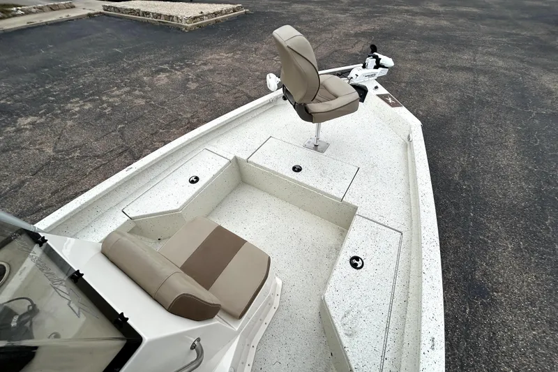 Slide: The Image of 2022 Xpress H20B Bay boat interior with seating and storage compartments. - 12