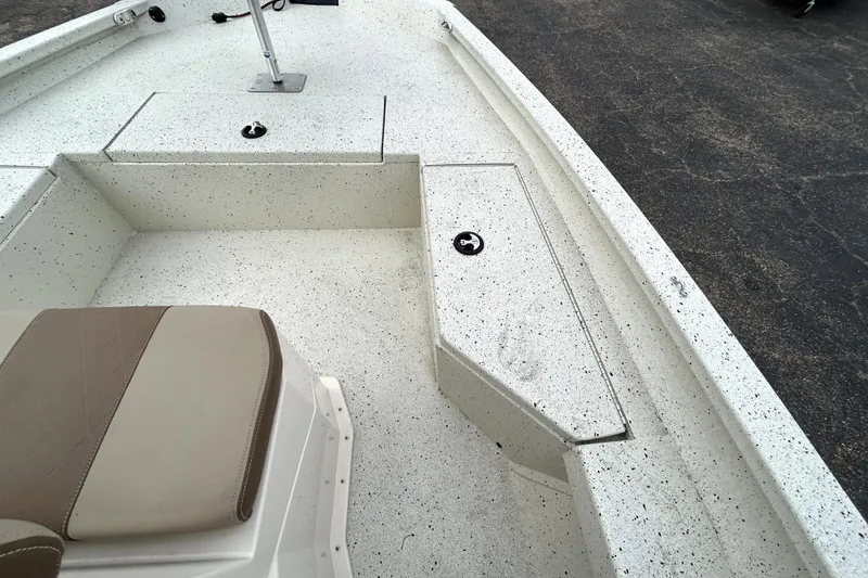 Slide: The Image of 2022 Xpress H20B Bay boat interior with seating and storage compartments. - 19