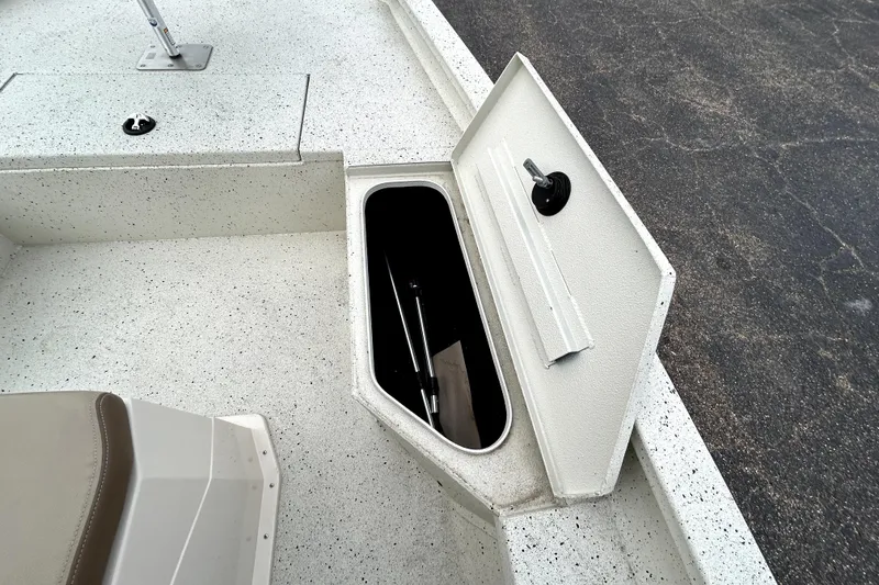 Slide: The Image of 2022 Xpress H20B Bay boat storage compartment with open hatch on deck. - 20