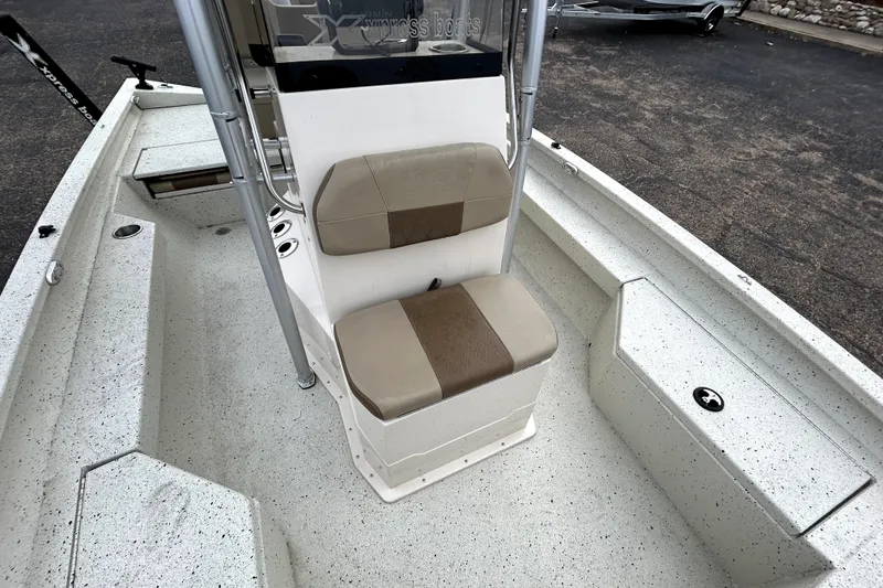 Slide: The Image of 2022 Xpress H20B Bay boat interior with seating and storage compartments. - 23