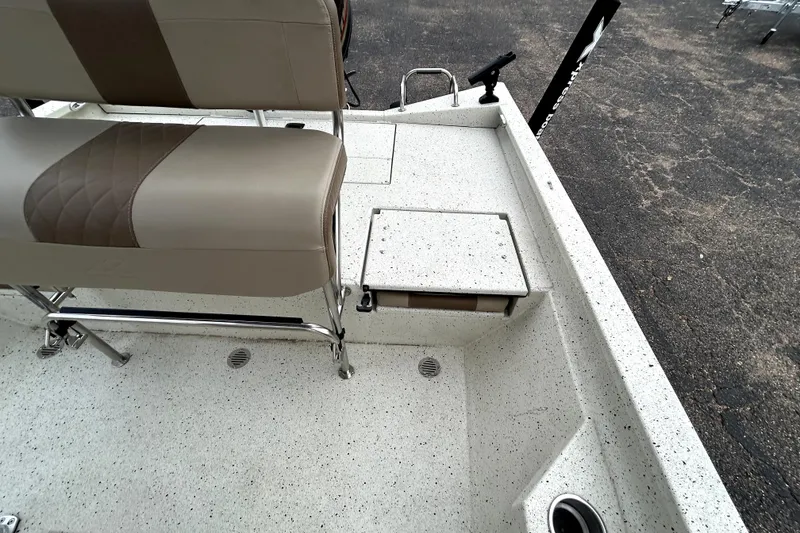 Slide: The Image of 2022 Xpress H20B Bay boat interior with seating and storage compartments. - 29