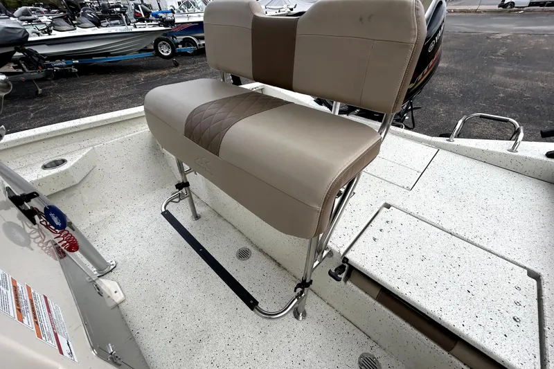 Slide: The Image of 2022 Xpress H20B Bay boat interior with beige seating and fishing deck. - 33