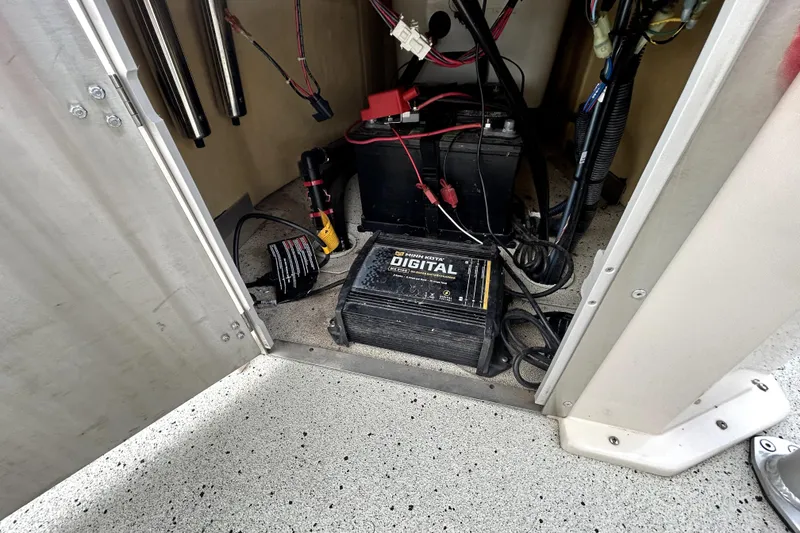 Slide: The Image of Battery compartment of 2022 Xpress H20B Bay boat with charger and wiring. - 36