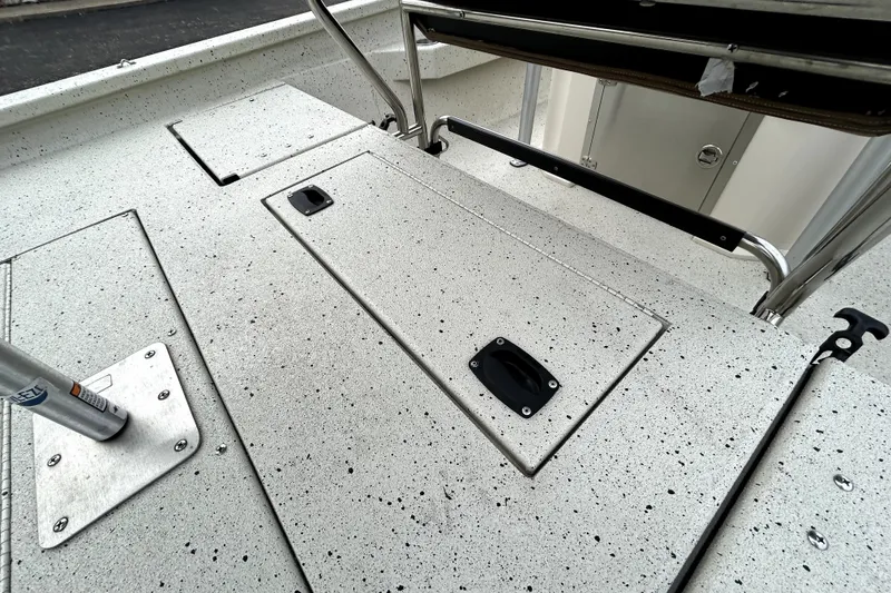 Slide: The Image of 2022 Xpress H20B Bay boat deck with storage compartments and sturdy railing. - 37