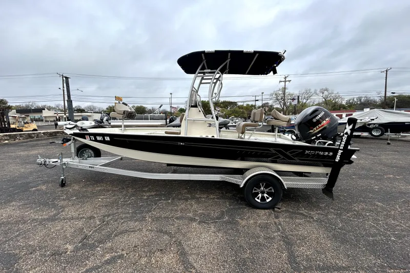 Slide: The Image of 2022 Xpress H20B Bay boat on trailer with Yamaha outboard motor. - 4