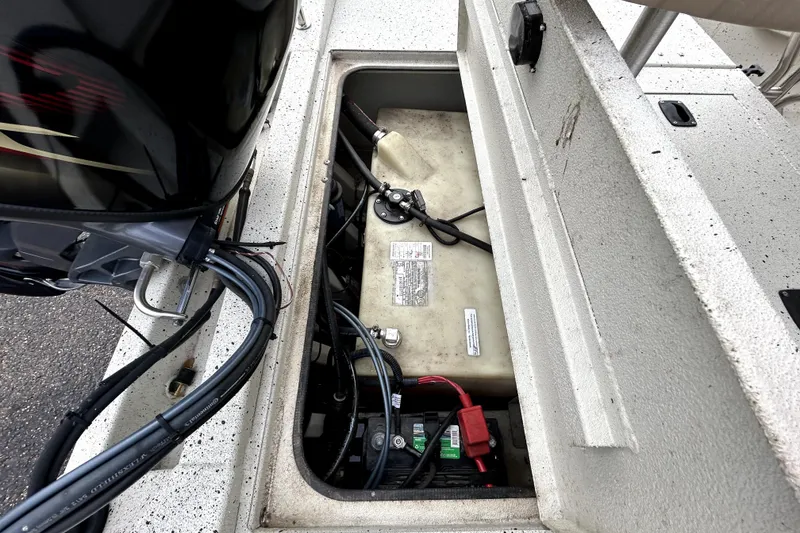 Slide: The Image of 2022 Xpress H20B Bay boat engine compartment with visible wiring and components. - 40