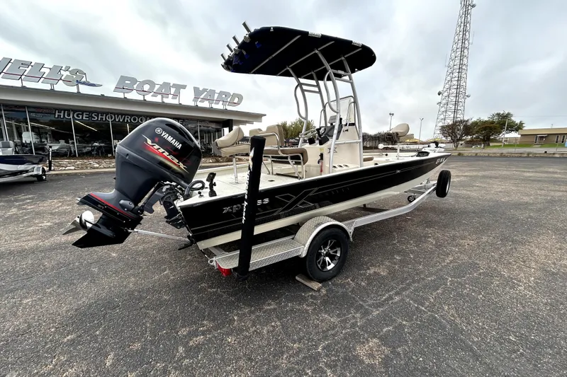 Slide: The Image of 2022 Xpress H20B Bay boat with Yamaha motor on trailer at dealership. - 7