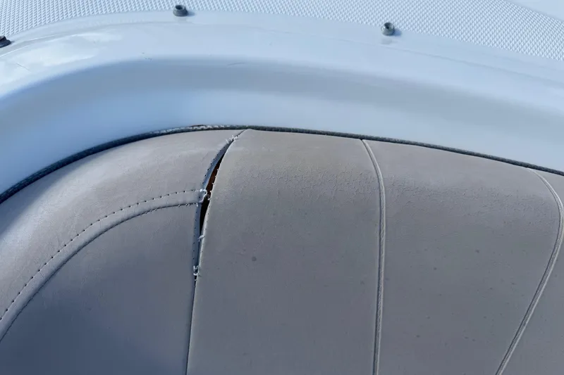 Slide: The Image of Torn upholstery on 2004 Sea Ray 240 Sundeck boat seat. - 24
