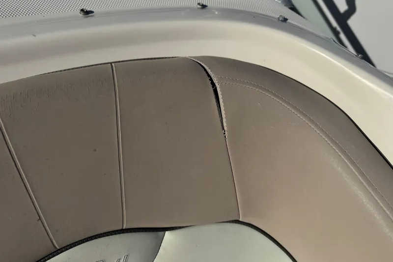 Slide: The Image of Torn upholstery on 2004 Sea Ray 240 Sundeck boat seat. - 25