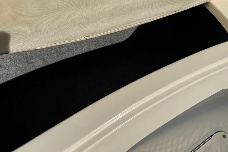 Slide: The Image of Storage compartment on a 2004 Sea Ray 240 Sundeck boat. - 27