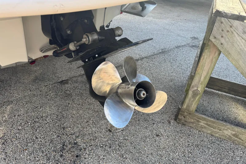 Slide: The Image of Propeller of a 2004 Sea Ray 240 Sundeck boat on a concrete surface. - 3