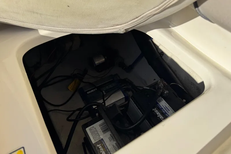 Slide: The Image of Battery compartment of a 2004 Sea Ray 240 Sundeck boat. - 30