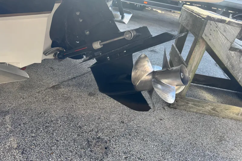 Slide: The Image of Propeller of a 2004 Sea Ray 240 Sundeck boat on a wooden stand. - 4