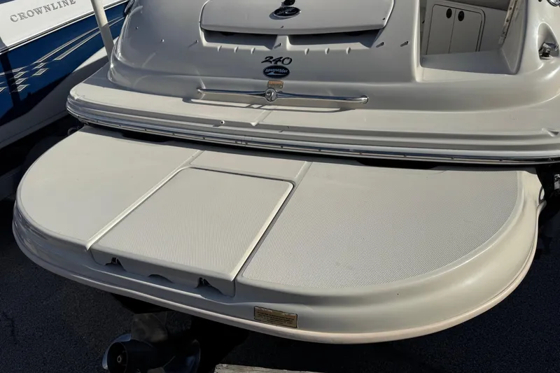 Slide: The Image of 2004 Sea Ray 240 Sundeck boat with spacious swim platform. - 5