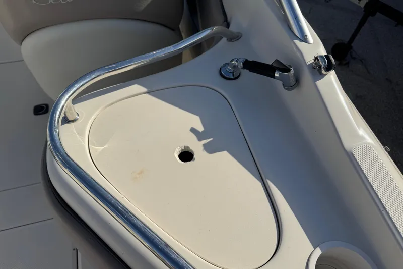 Slide: The Image of 2004 Sea Ray 240 Sundeck boat detail with railing and seat. - 7