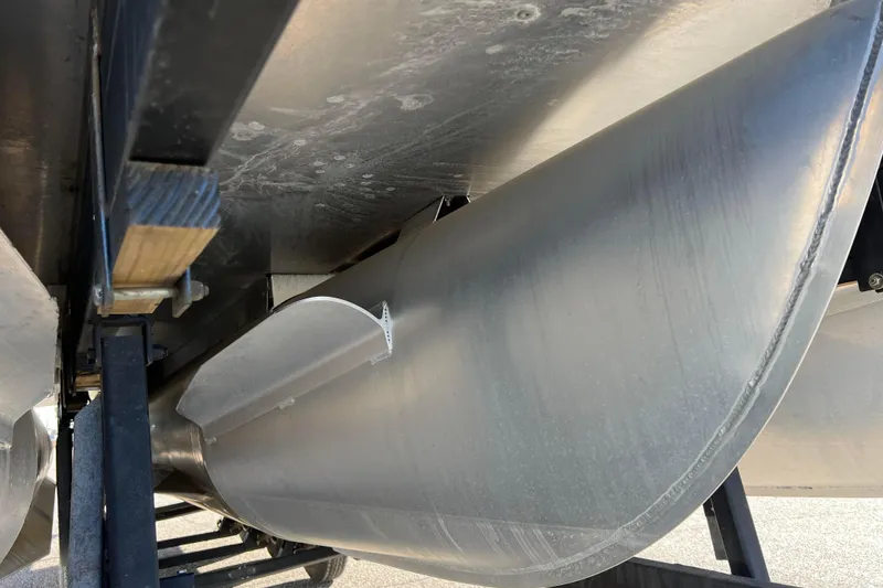 Slide: The Image of Close-up of 2022 Sylvan Mirage X1 Tritoon pontoon undercarriage on a trailer. - 13