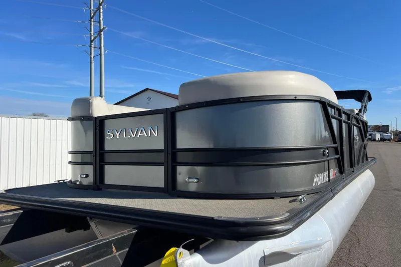 Slide: The Image of 2022 Sylvan Mirage X1 Tritoon boat with sleek design on a sunny day. - 4