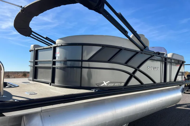 Slide: The Image of 2022 Sylvan Mirage X1 Tritoon boat with sleek design and sturdy construction. - 7