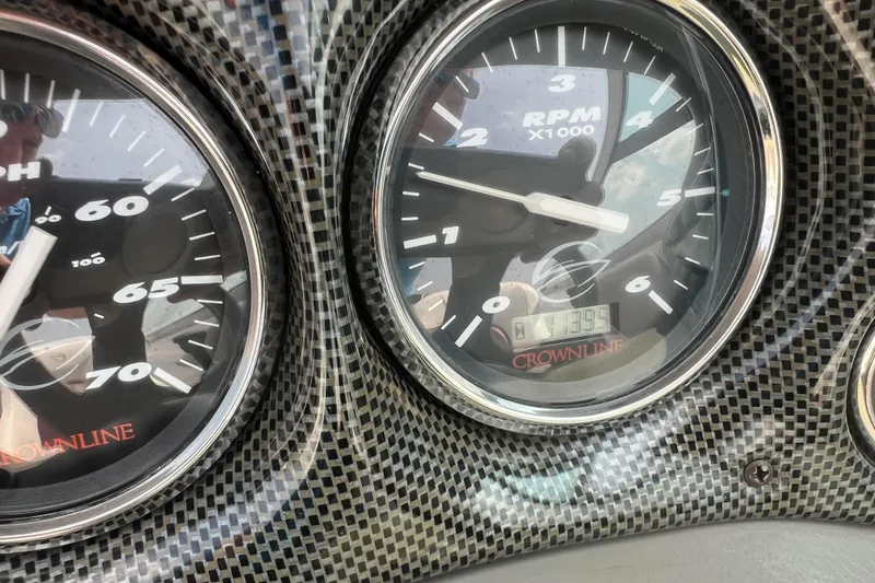 Slide: The Image of Dashboard of a 2003 Crownline 230 BR boat showing speedometer and tachometer. - 35